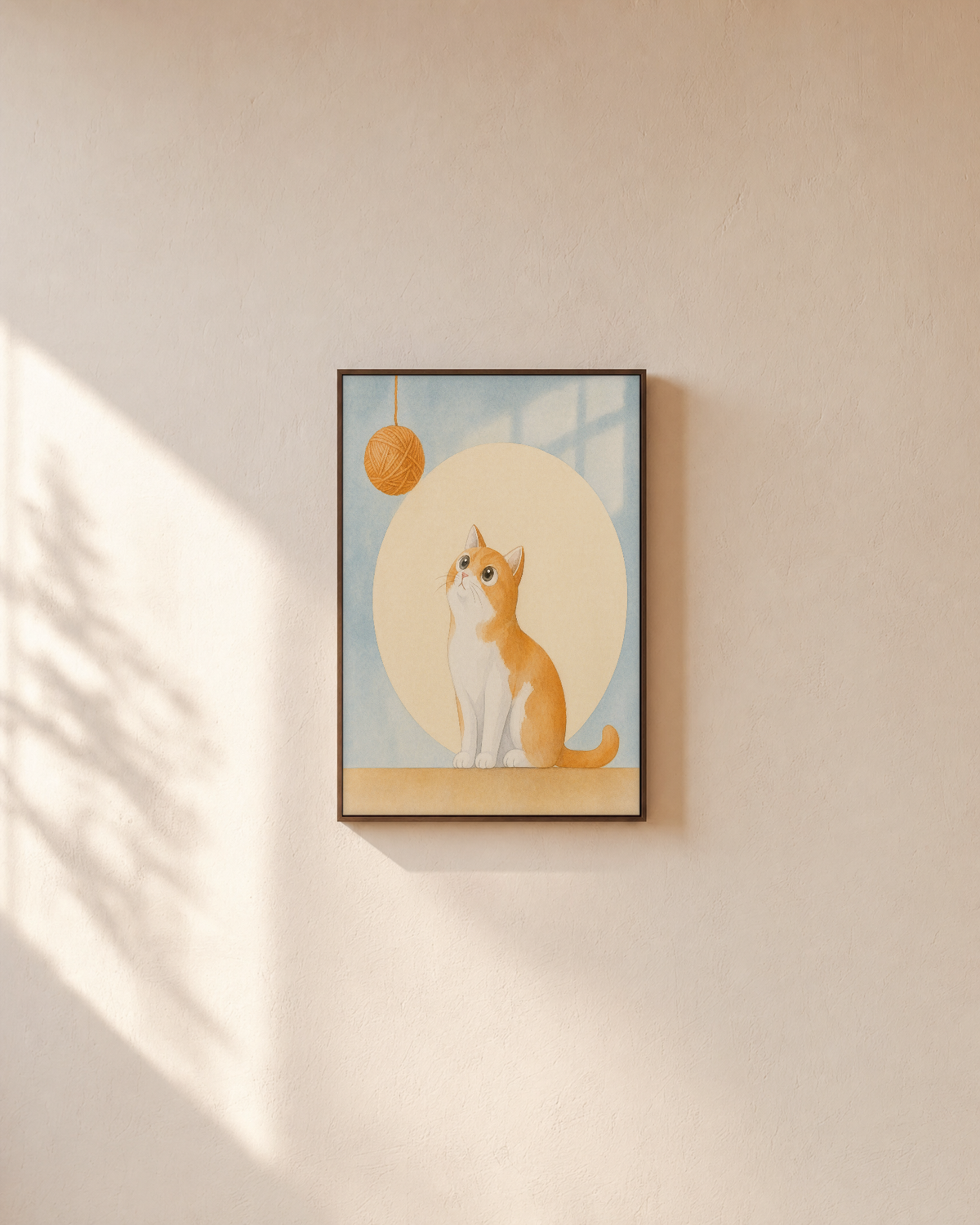 Orange Cat Yarn Drop unframed print is shown framed for styling in a plain wall; frame not included