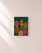 Garden Seahorse seahorse wall art: unframed print is shown framed for styling on a plain wall; frame not included