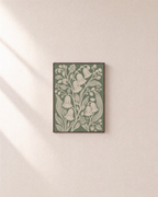 Bell Garden cream bell sage panel wall art: unframed print is shown framed for styling on a plain wall; frame not included