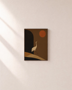 Crane Over Umber Arch unframed print is shown framed for styling in a plain wall; frame not included