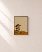 Checkered Persimmon Pitcher unframed print is shown framed for styling in a plain wall; frame not included