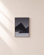 Charcoal Ridges unframed print is shown framed for styling in a plain wall; frame not included
