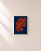 Acorn Watch oak leaf wall art: unframed print is shown framed for styling on a plain wall; frame not included