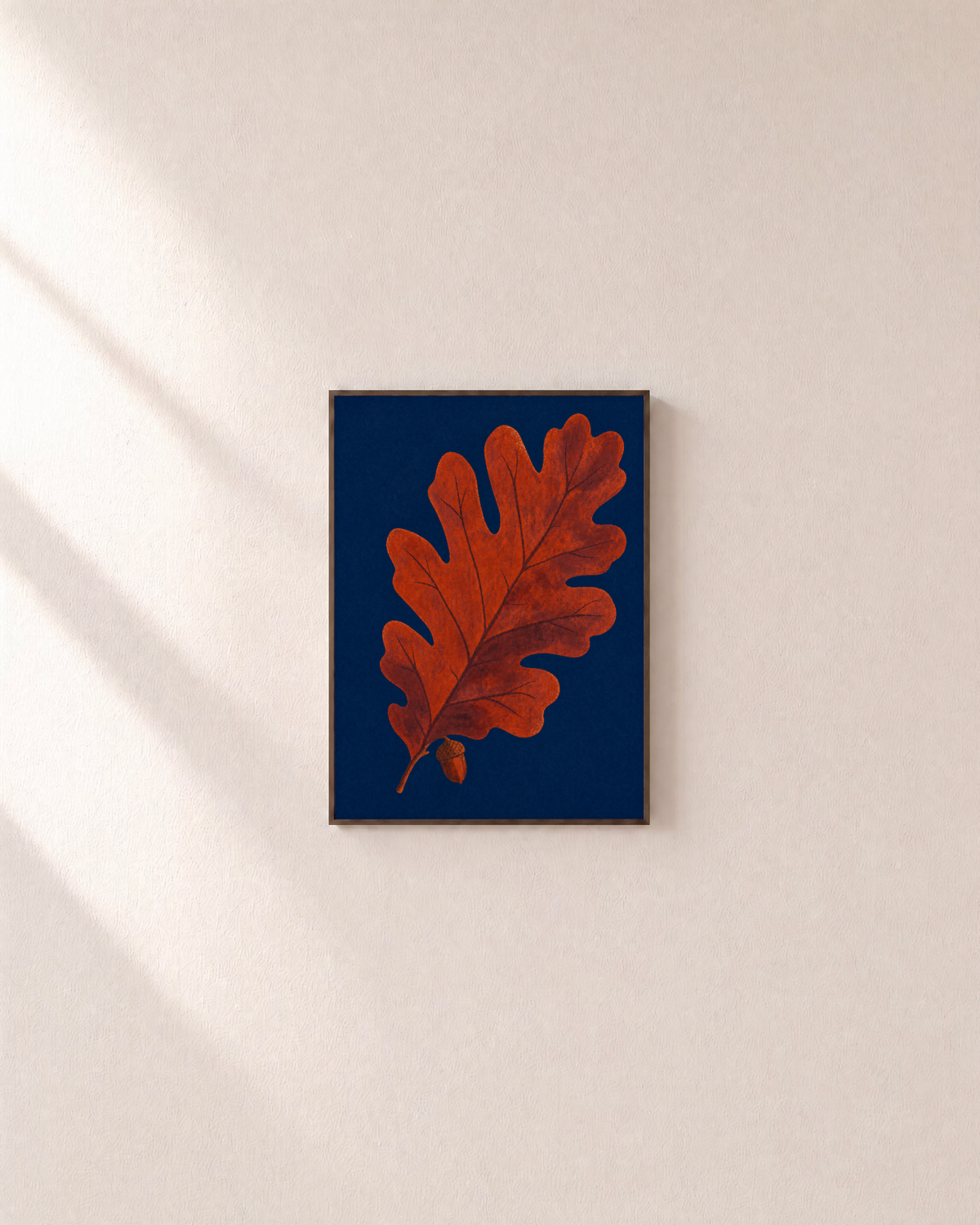 Acorn Watch oak leaf wall art: unframed print is shown framed for styling on a plain wall; frame not included