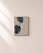 Dark Leaves over Striped Pot striped vase botanical wall art print: unframed print is shown framed for styling on a plain wall; frame not included