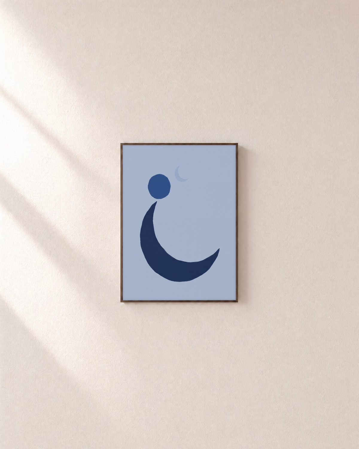 Navy Crescent with Blue Circle blue moon wall art: unframed print is shown framed for styling on a plain wall; frame not included