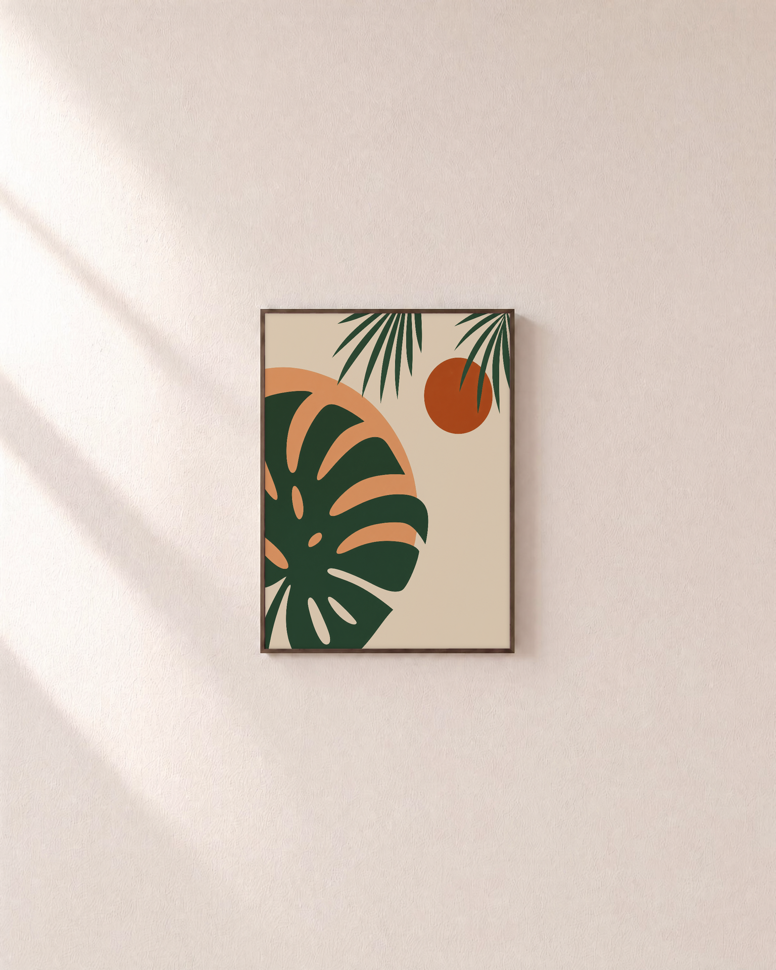 Monstera Cut Across Two Suns unframed print is shown framed for styling in a plain wall; frame not included