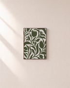 Bud Hour olive tulip silhouette wall art: unframed print is shown framed for styling on a plain wall; frame not included