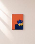 Cobalt Teapot Two Apples unframed print is shown framed for styling in a plain wall; frame not included