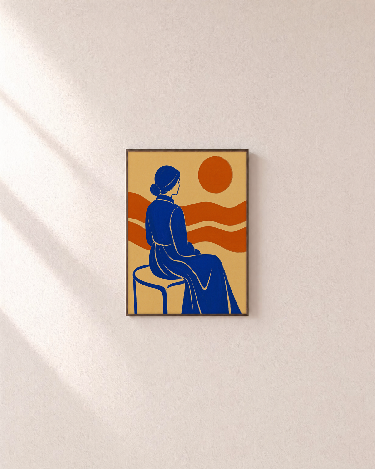 River Sitter seated cobalt figure wall art: unframed print is shown framed for styling on a plain wall; frame not included