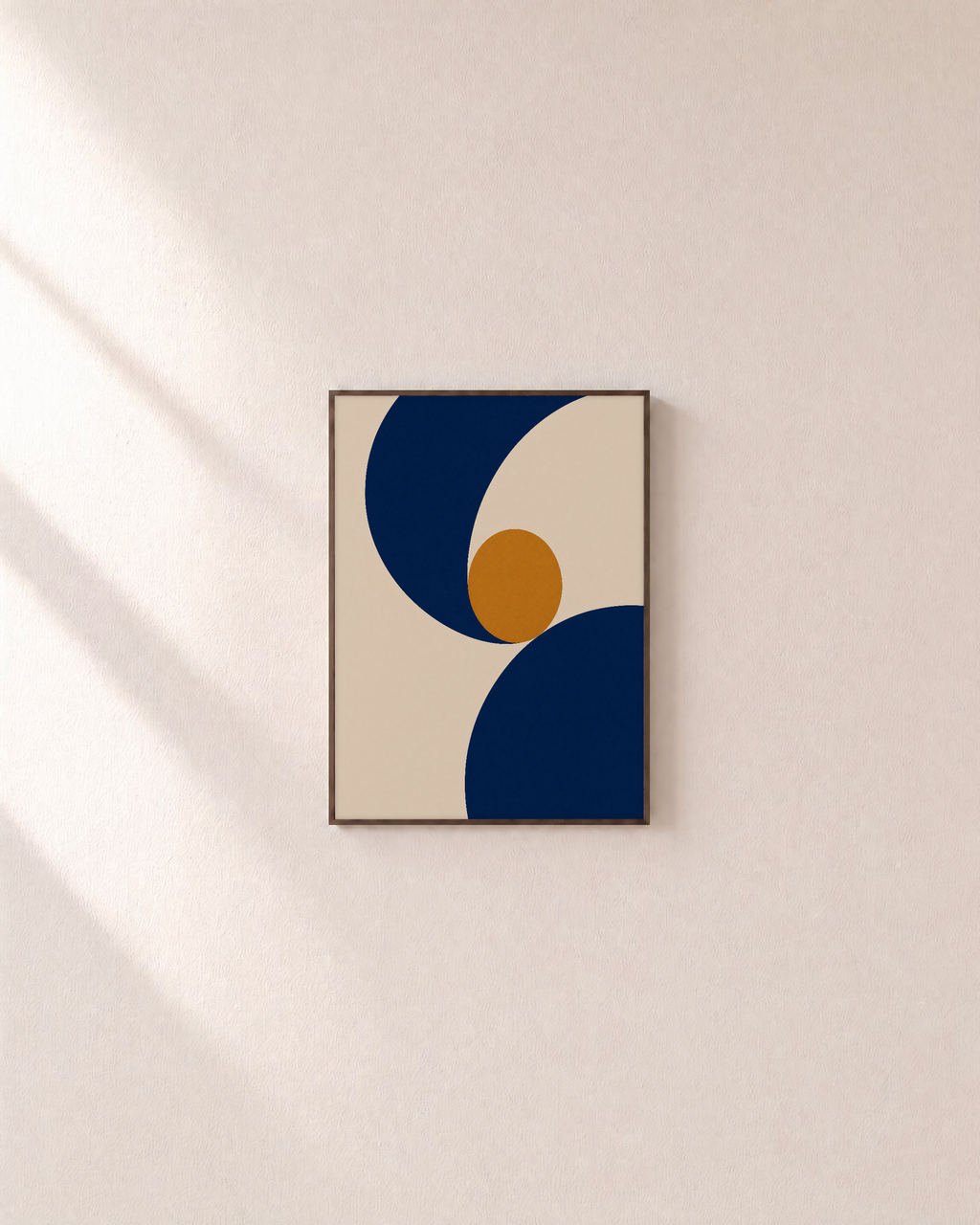 Two Navy Arcs One Ochre Disk unframed print is shown framed for styling in a plain wall; frame not included