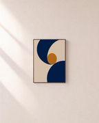 Two Navy Arcs One Ochre Disk unframed print is shown framed for styling in a plain wall; frame not included