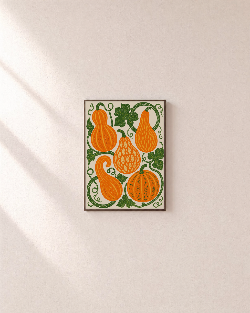 Vine Gourds orange gourd wall art: unframed print is shown framed for styling on a plain wall; frame not included
