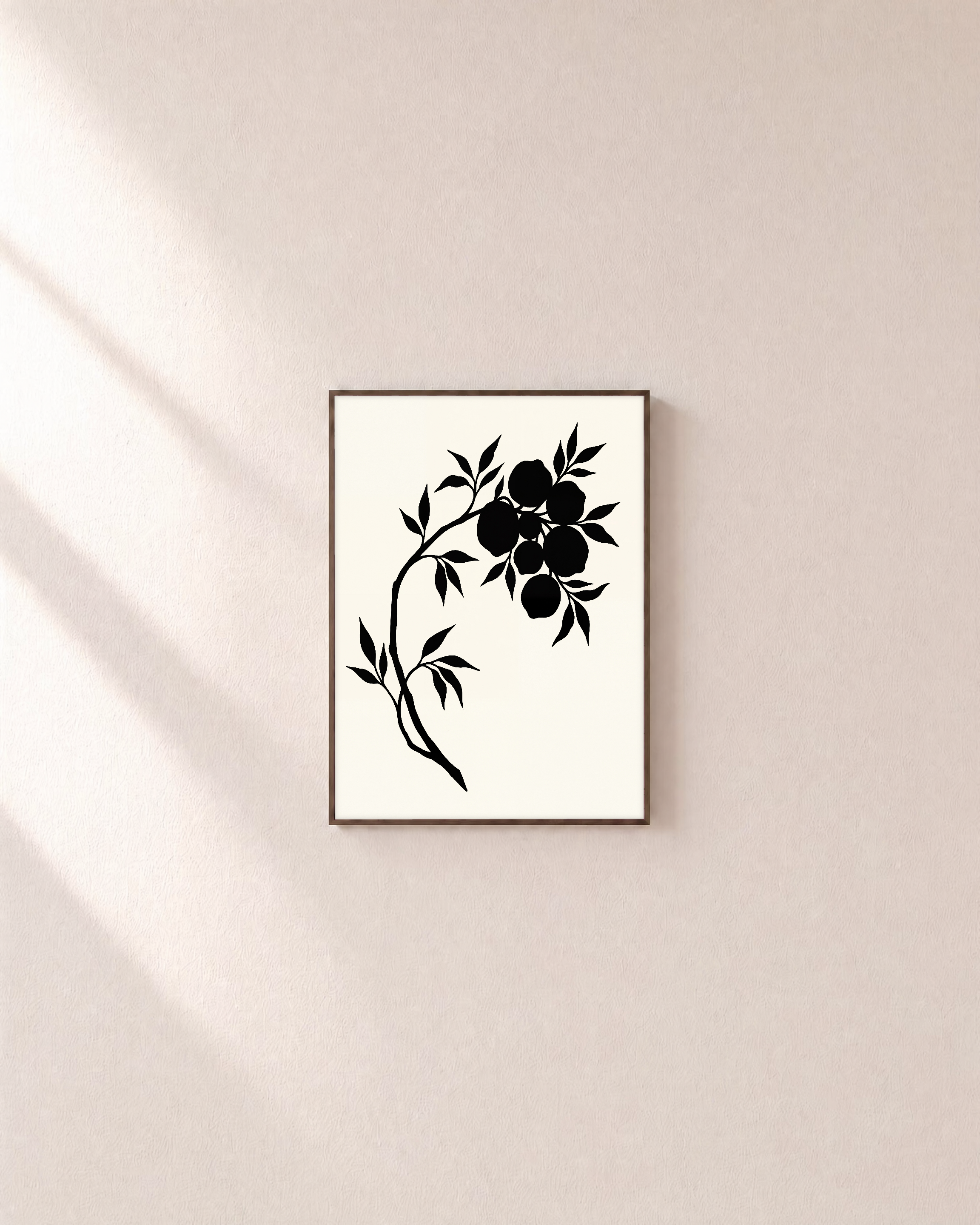 Ink Branch Fruit unframed print is shown framed for styling in a plain wall; frame not included