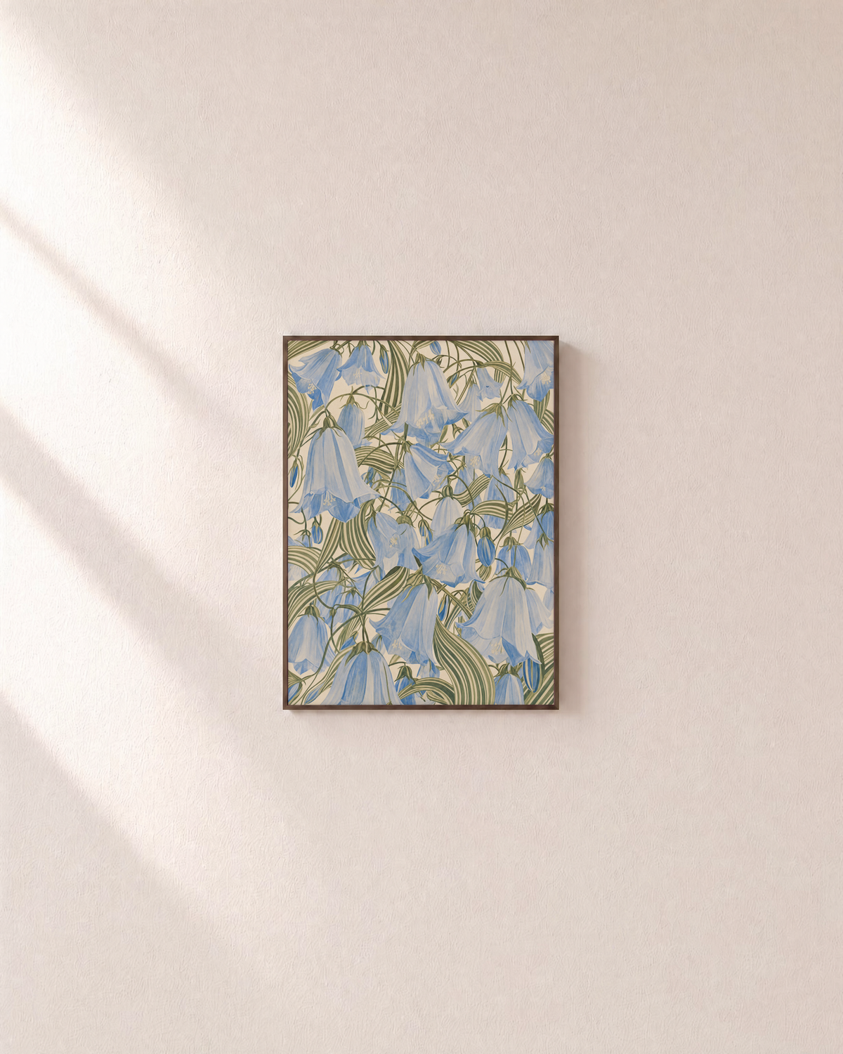 Blue Bells blue bellflower wall art: unframed print is shown framed for styling on a plain wall; frame not included