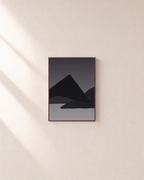 Layered Black Mountain Ridges black geometric wall art: unframed print is shown framed for styling on a plain wall; frame not included