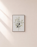 Three Olive Sprigs Two Figs unframed print is shown framed for styling in a plain wall; frame not included