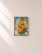 Citrus Noon citrus wheel wall art: unframed print is shown framed for styling on a plain wall; frame not included