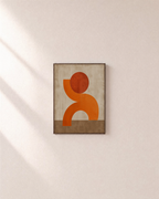 Arch Hour orange arch print: unframed print is shown framed for styling on a plain wall; frame not included