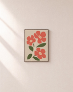 Morning Blooms coral botanical prints: unframed print is shown framed for styling on a plain wall; frame not included