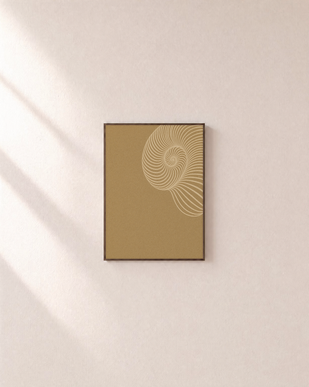 Cream Shell Spiral unframed print is shown framed for styling in a plain wall; frame not included