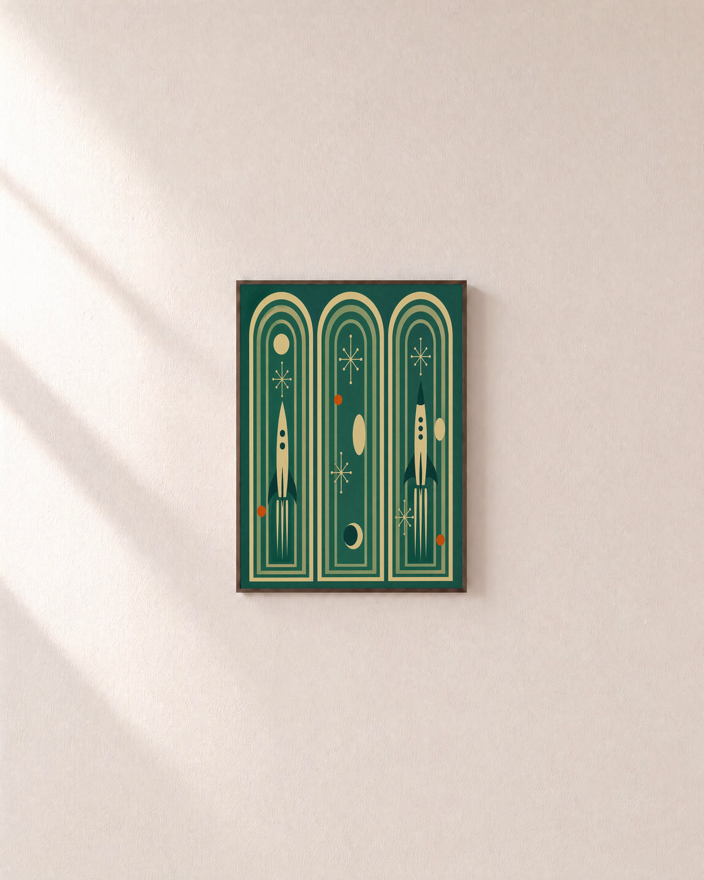 Three Launches teal rocket arch print: unframed print is shown framed for styling on a plain wall; frame not included