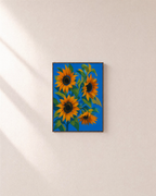 Sunflower Hour sunflower art print: unframed print is shown framed for styling on a plain wall; frame not included