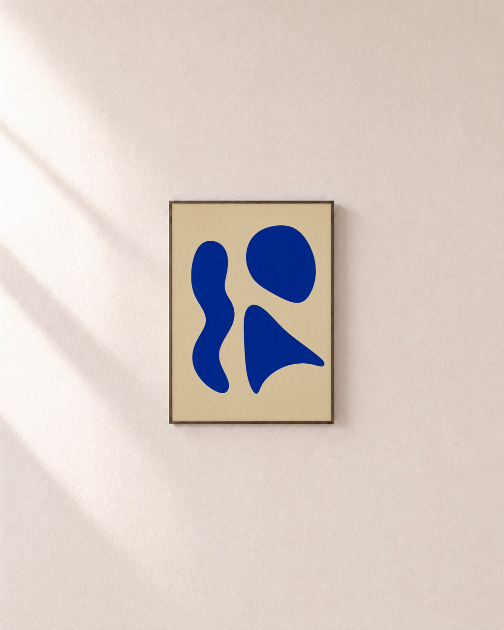 One Rest cobalt shape wall art: unframed print is shown framed for styling on a plain wall; frame not included