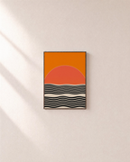 Low Sun orange sun ripple wall art: unframed print is shown framed for styling on a plain wall; frame not included
