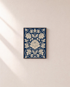 Three Peonies Navy Weave unframed print is shown framed for styling in a plain wall; frame not included