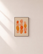 Afternoon Stack warm oval stack wall art: unframed print is shown framed for styling on a plain wall; frame not included