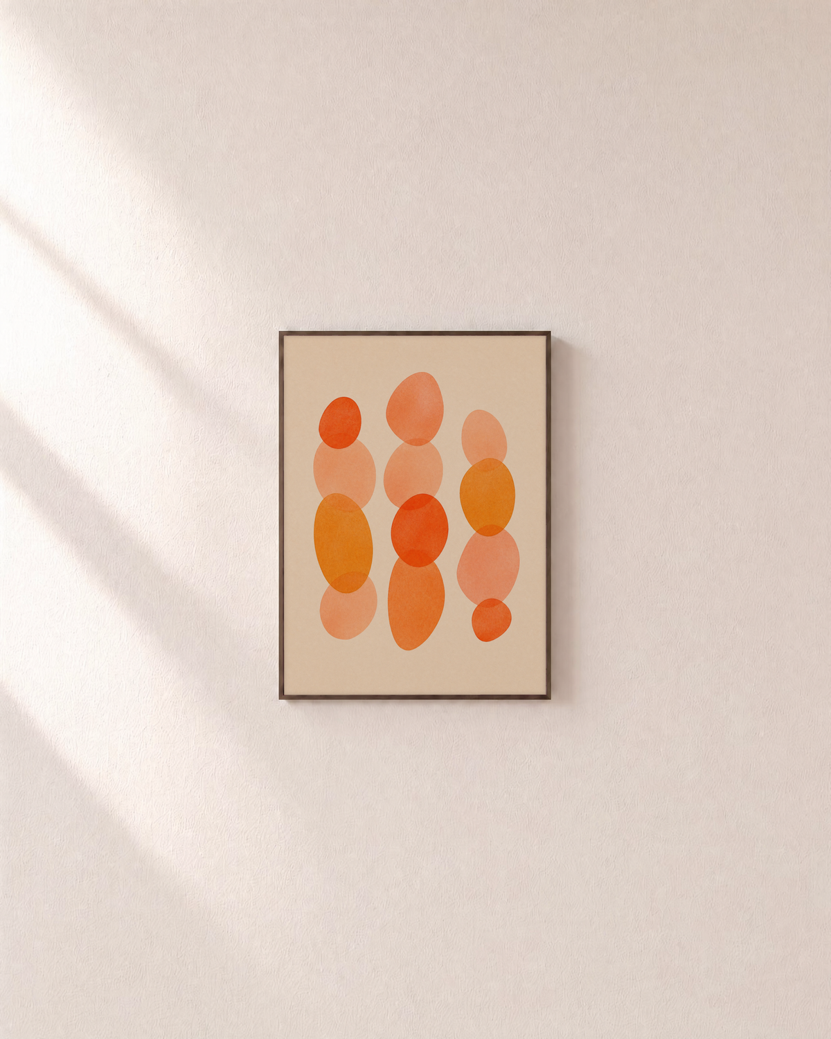 Afternoon Stack warm oval stack wall art: unframed print is shown framed for styling on a plain wall; frame not included