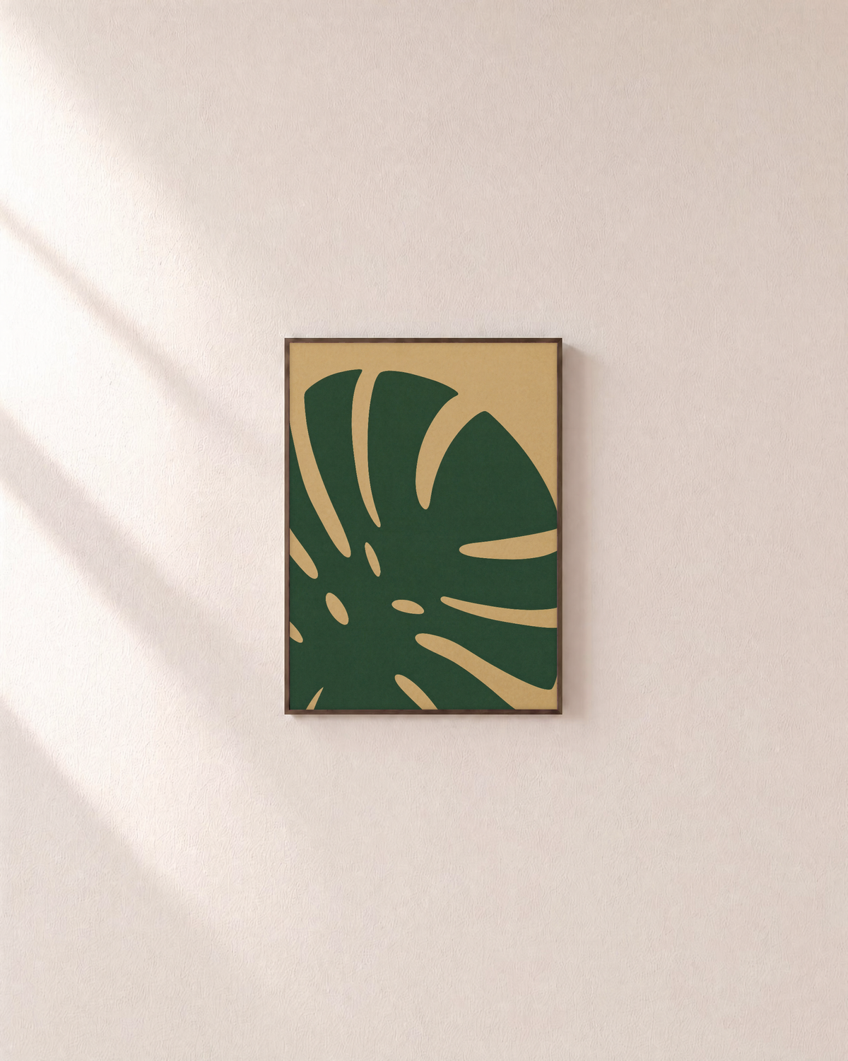 Monstera Cut monstera leaf wall art: unframed print is shown framed for styling on a plain wall; frame not included