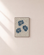 Peony Lattice indigo peony wall art: unframed print is shown framed for styling on a plain wall; frame not included
