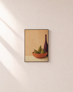 Coral Bowl and Purple Bottle pears and purple bottle wall art print: unframed print is shown framed for styling on a plain wall; frame not included