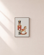 Toy Guard rocking horse print: unframed print is shown framed for styling on a plain wall; frame not included