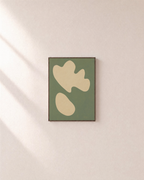Cream Shapes on Green Field green and cream organic shapes wall art print: unframed print is shown framed for styling on a plain wall; frame not included