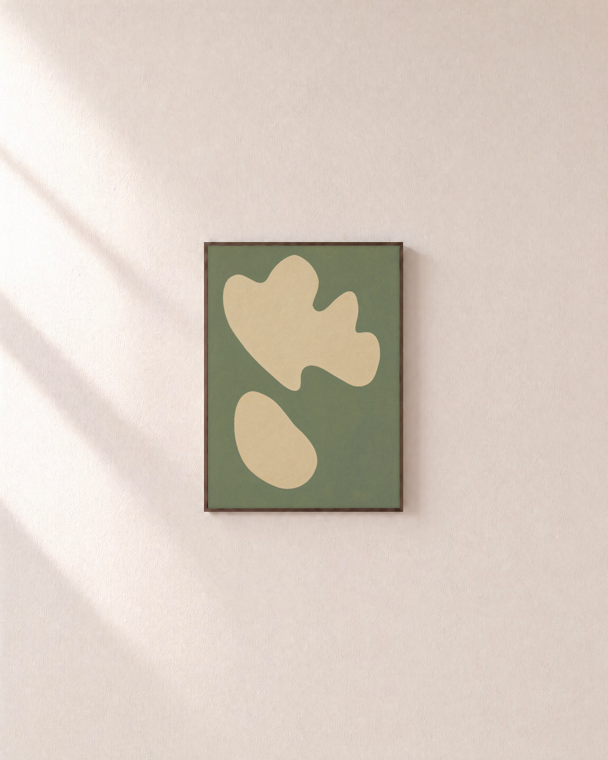 Cream Shapes on Green Field green and cream organic shapes wall art print: unframed print is shown framed for styling on a plain wall; frame not included