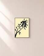 Ink Branch Fruit unframed print is shown framed for styling in a plain wall; frame not included