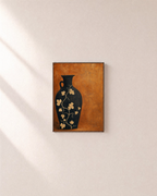 Black Amphora Motif unframed print is shown framed for styling in a plain wall; frame not included