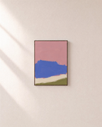 Blue Landform Over Pink Bands blue and pink abstract wall art: unframed print is shown framed for styling on a plain wall; frame not included