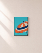 Noon Parasol beach wall art: unframed print is shown framed for styling on a plain wall; frame not included