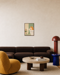 Bathing Orange Cat Near Flowers orange cat print: unframed print is shown framed for styling in a living room; frame not included