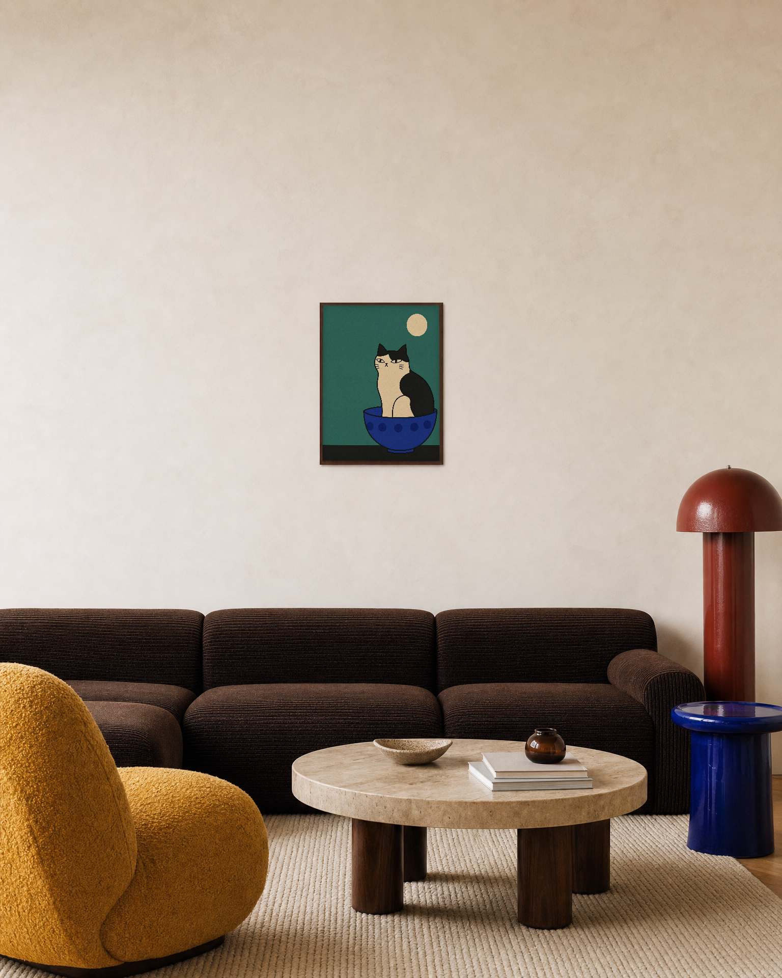 One Cat Cobalt Bowl unframed print is shown framed for styling in a living room; frame not included