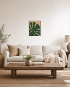 Monstera Cut monstera leaf wall art: unframed print is shown framed for styling in a living room; frame not included