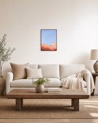Peach Dune Blue Press edition unframed print is shown framed for styling in a living room; Frame not included