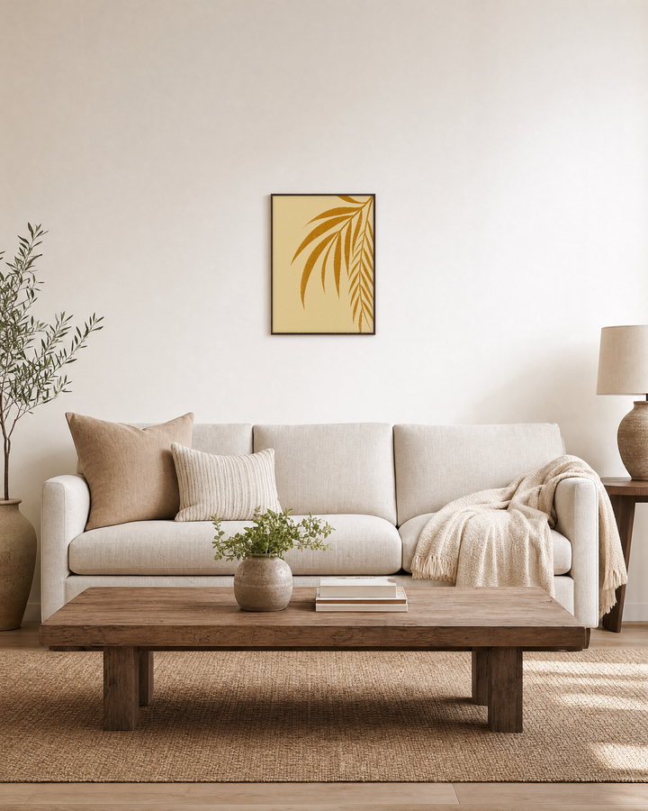 Twin Palm Blades at an Angle ochre leaf print: unframed print is shown framed for styling in a living room; frame not included