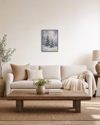 Spruce Tracks snow spruce print: unframed print is shown framed for styling in a living room; frame not included