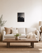 Charcoal Ridges unframed print is shown framed for styling in a living room; frame not included
