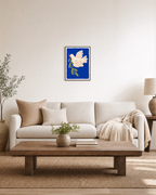 Dove Branch Blue unframed print is shown framed for styling in a living room; frame not included